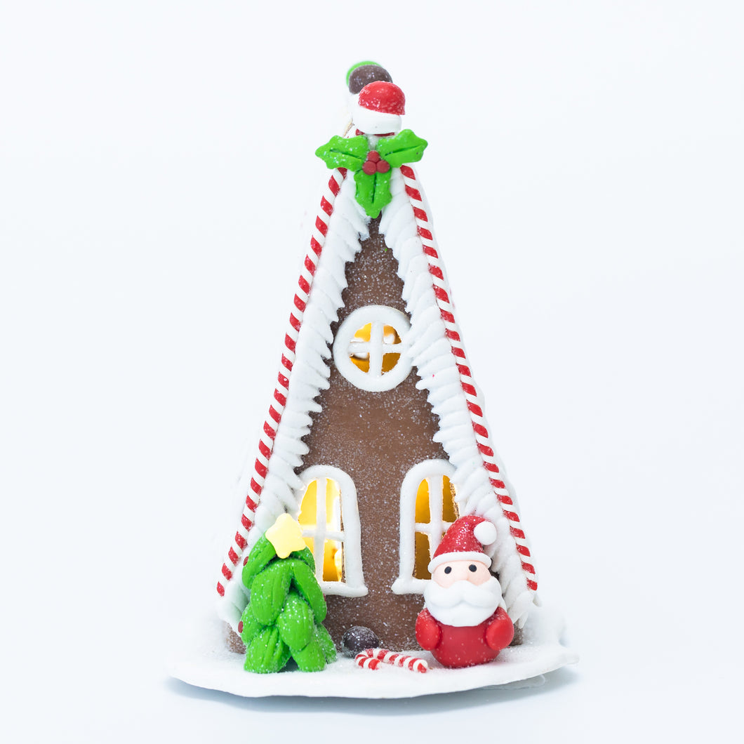 Gingerbread chalet with Santa Claus