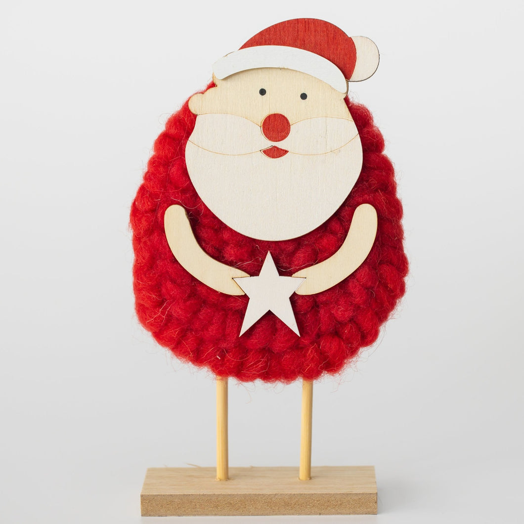 Wood and wool red Santa Claus