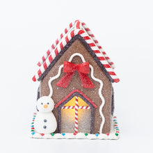 Load image into Gallery viewer, Pre-lit gingerbread house with a snowman and a bow
